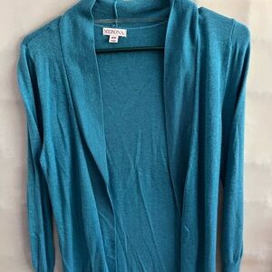 Woman’s light weight buttonless sweater, slightly used.